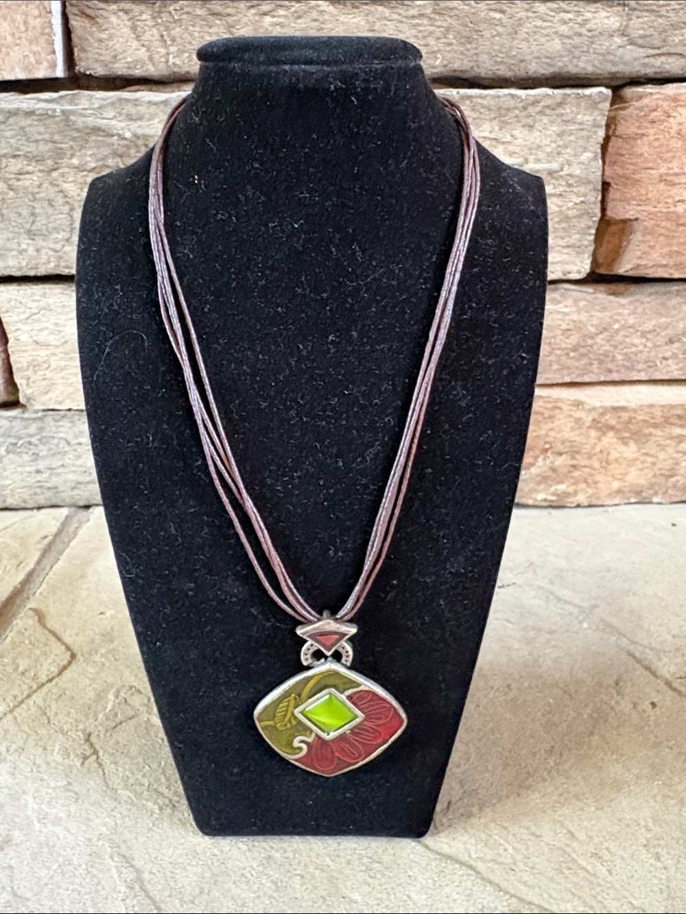 Chico’s brown corded Peter looking pendant with green and deep red floral